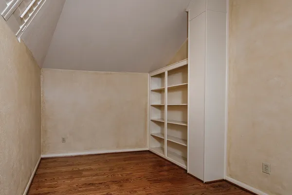 a view of a hallway with seating area