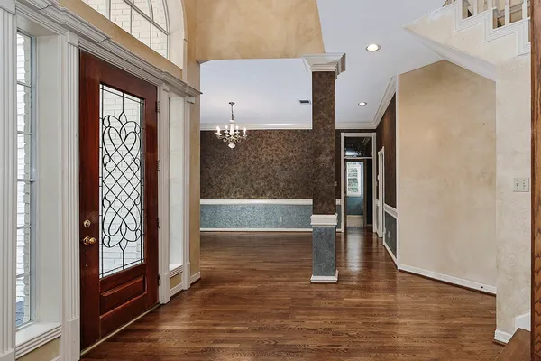 a view of livingroom with window wooden floor and front door