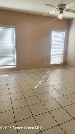 a view of an empty room and a window