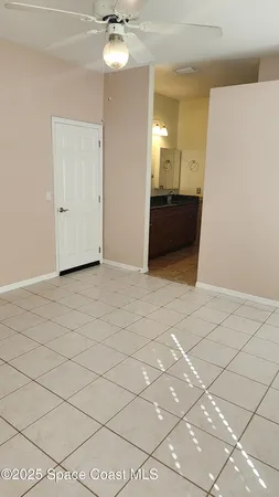 a view of a kitchen with a sink and cabinets