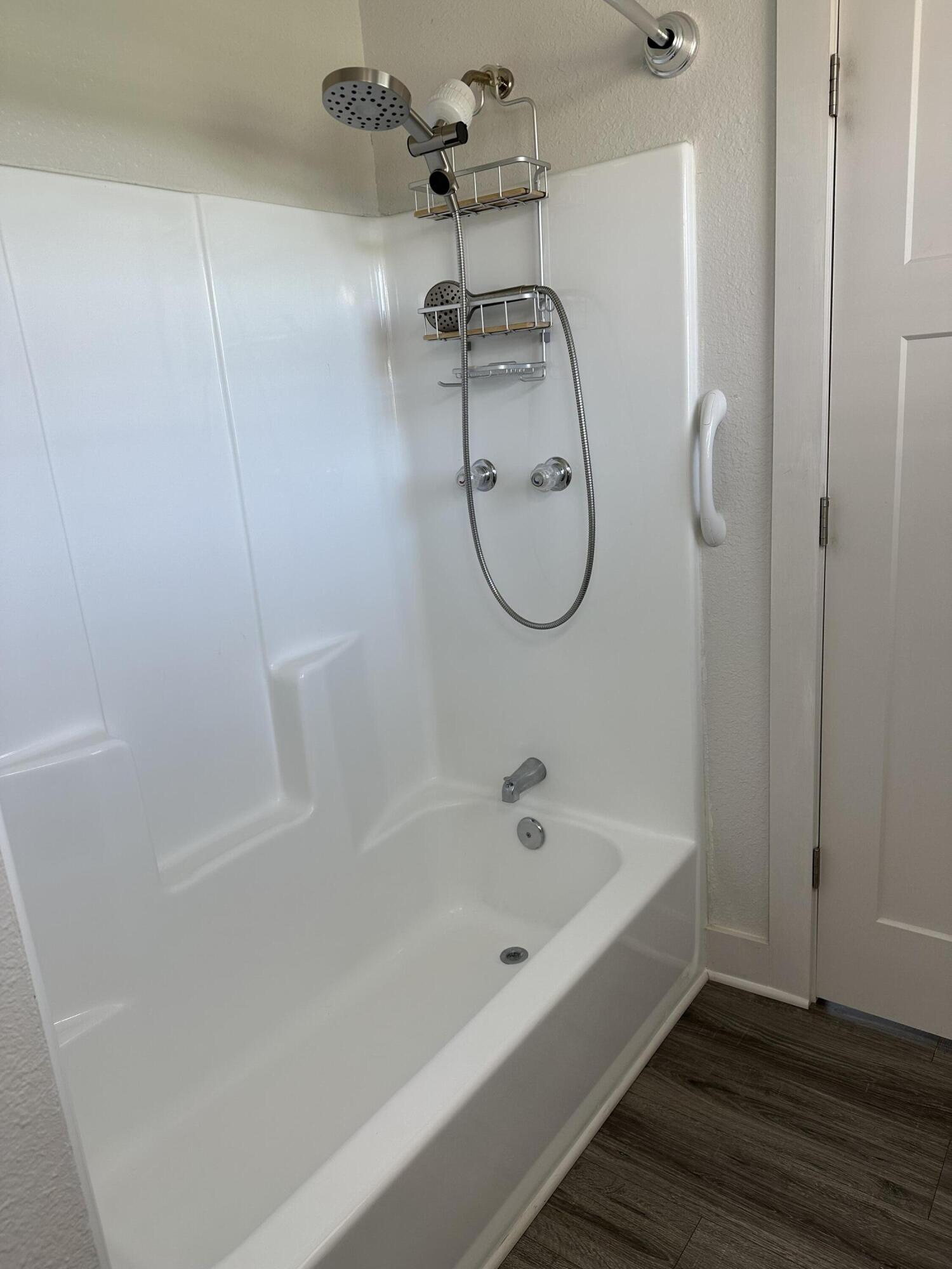 1014 East Indian Creek Ranch Road DeFuniak Springs, FL 32435 - Photo 12 of 17 a bathroom with a bathtub a shower and a shower
