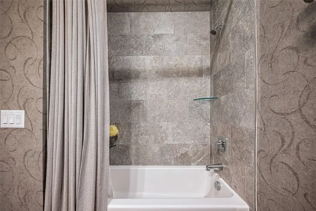 a bath tub with a shower