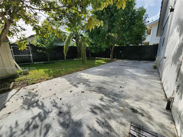 a backyard of a house with lots of green space
