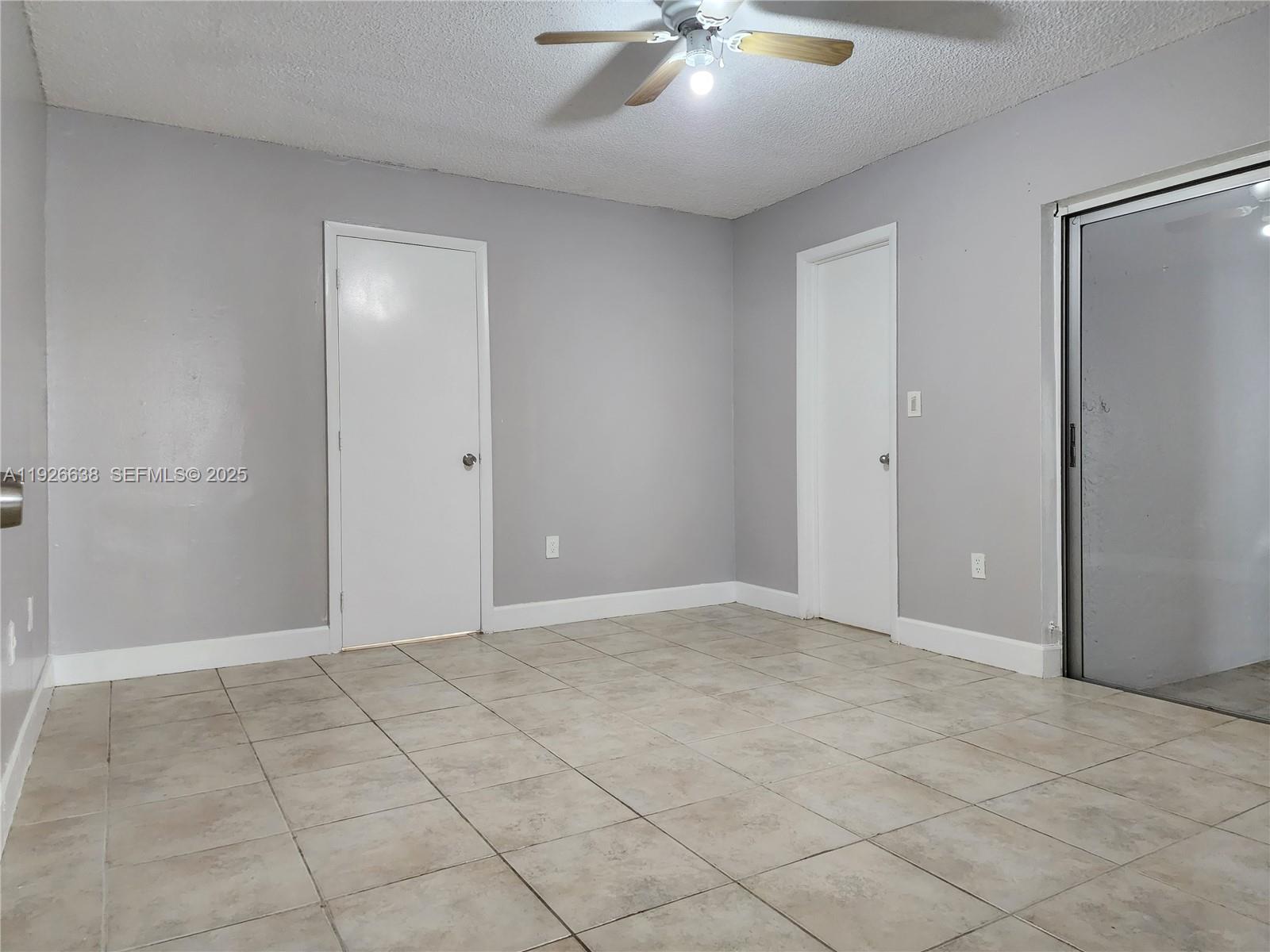 2438 Southwest 114th Avenue Miami, FL 33165 - Photo 8 of 15 an empty room with fan