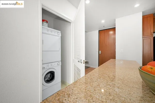 a kitchen with a stove a sink and cabinets
