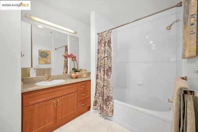 a bedroom with a bed and a mirror