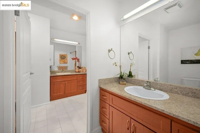 a view of a hallway with wooden shelves