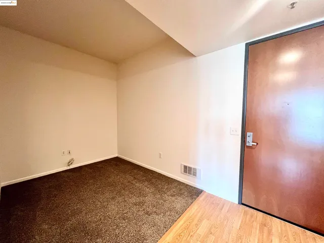 a view of tall building with large windows