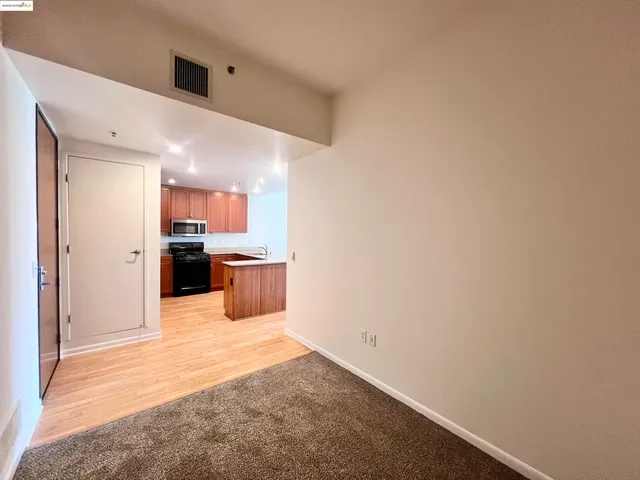 an empty room with wooden floor