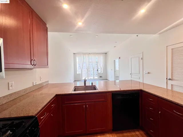 a kitchen with a refrigerator and a sink