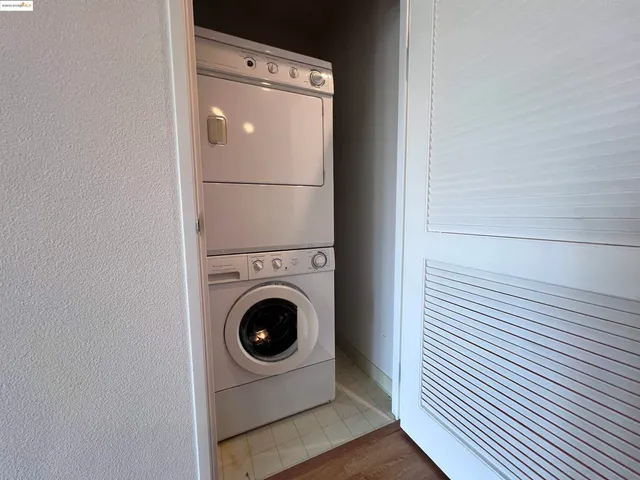 a kitchen with granite countertop a sink and cabinets