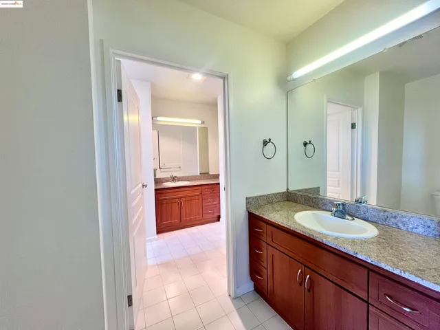 a view of a big room with a kitchen