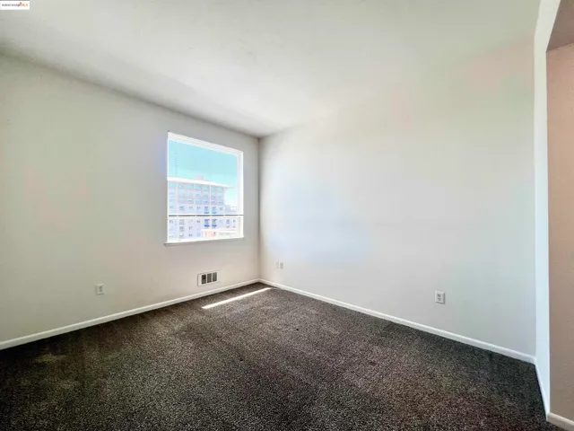 a bathroom with a granite countertop tub sink and mirror