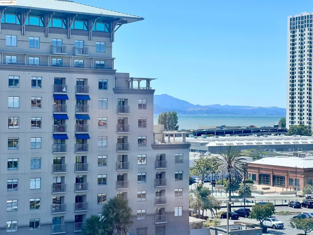 an empty room with closet and mirror