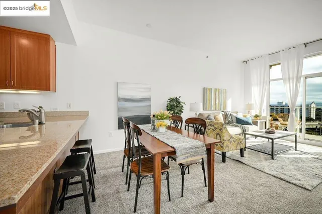 a view of a dining room with furniture and a window