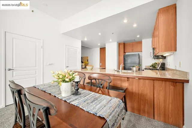 a view of a dining room with furniture and a window