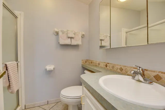 a bathroom with a sink toilet and vanity