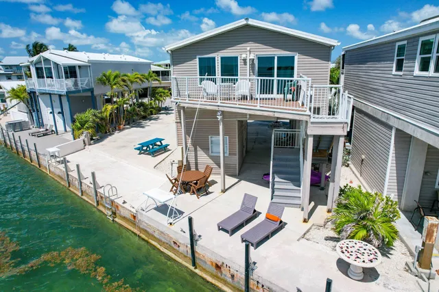 a front view of house with yard and seating area