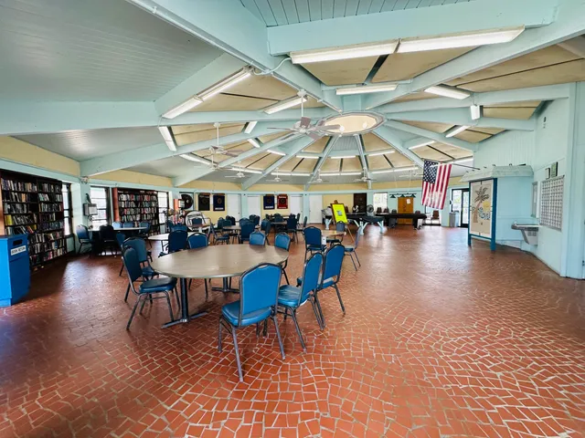 an aerial view of a house with a backyard