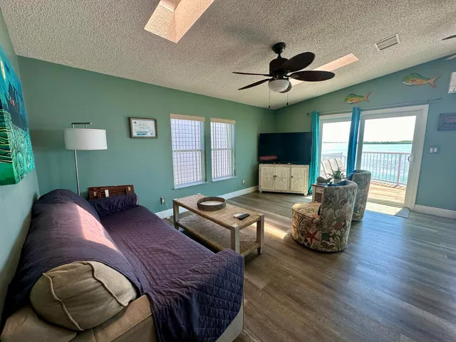 a bedroom with furniture and a wooden floor