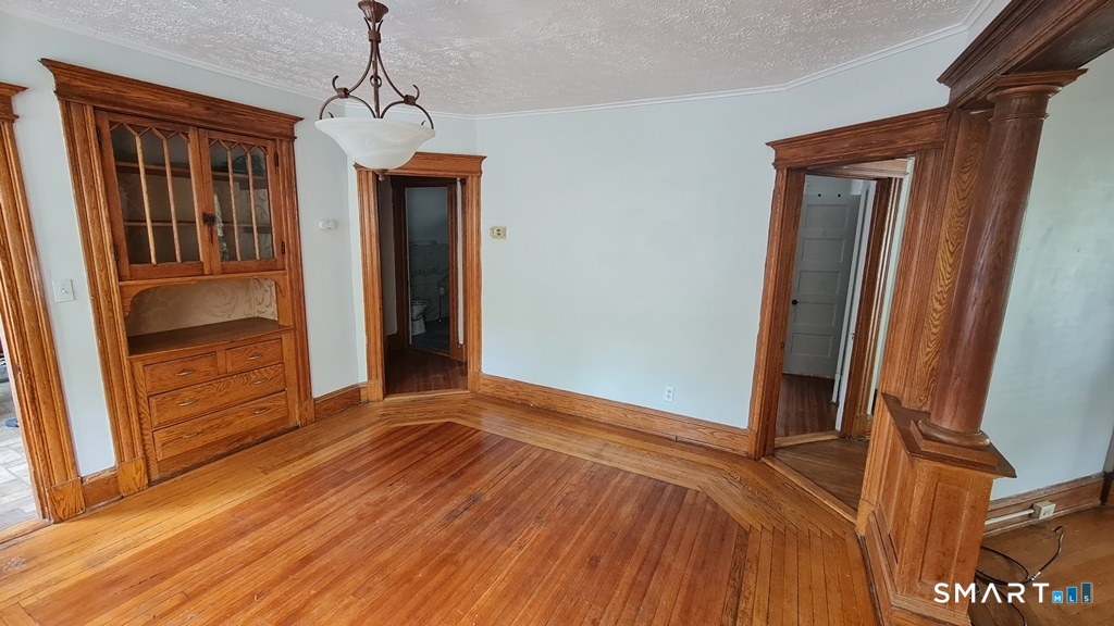 64-66 Ridge Street Manchester, CT 06040 - Photo 13 of 21 a view of a room with wooden floor and stairs