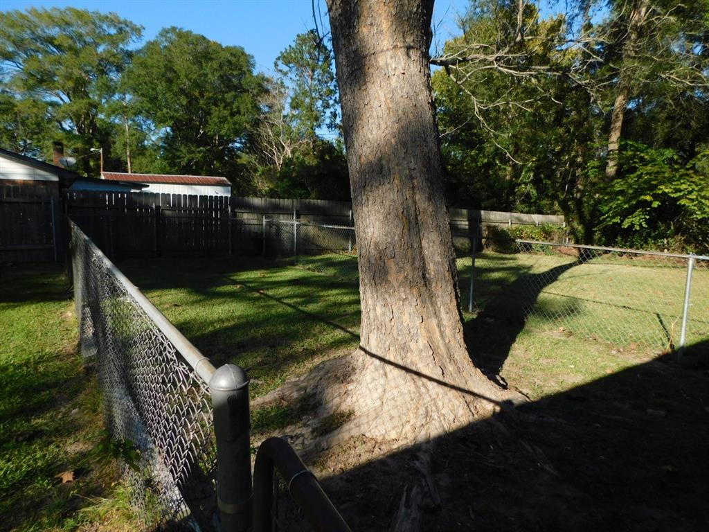 405 8th Street Northwest Springhill, LA 71075 - Photo 11 of 25 a view of a backyard with sitting area