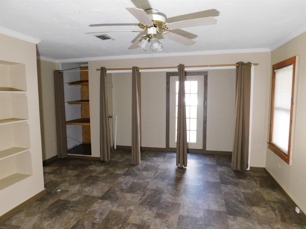 405 8th Street Northwest Springhill, LA 71075 - Photo 21 of 25 wooden floor in an empty room with a window