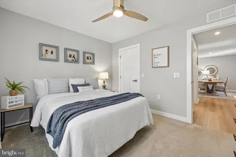 a bed room with a bed and a chandelier