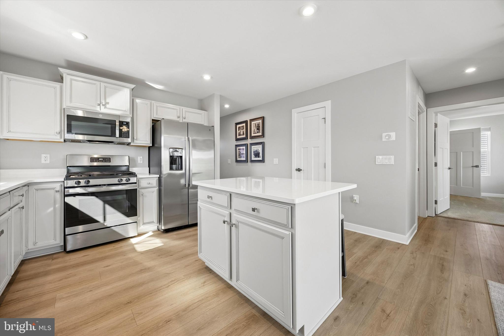 48 Senators Way Berlin, NJ 08009 - Photo 17 of 35 a kitchen with white cabinets and stainless steel appliances