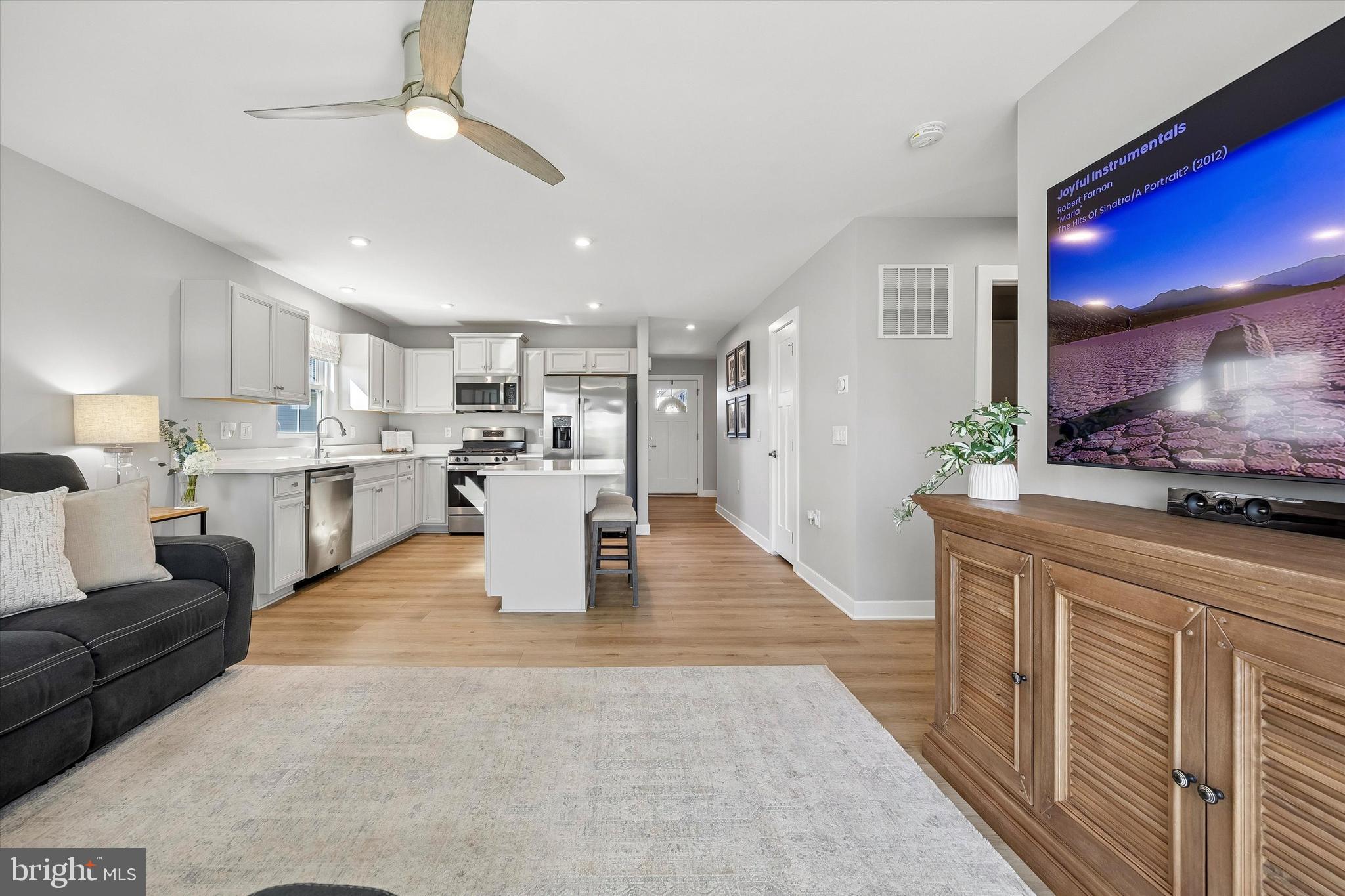 48 Senators Way Berlin, NJ 08009 - Photo 22 of 35 a large kitchen with stainless steel appliances kitchen island granite countertop a refrigerator and a stove top oven
