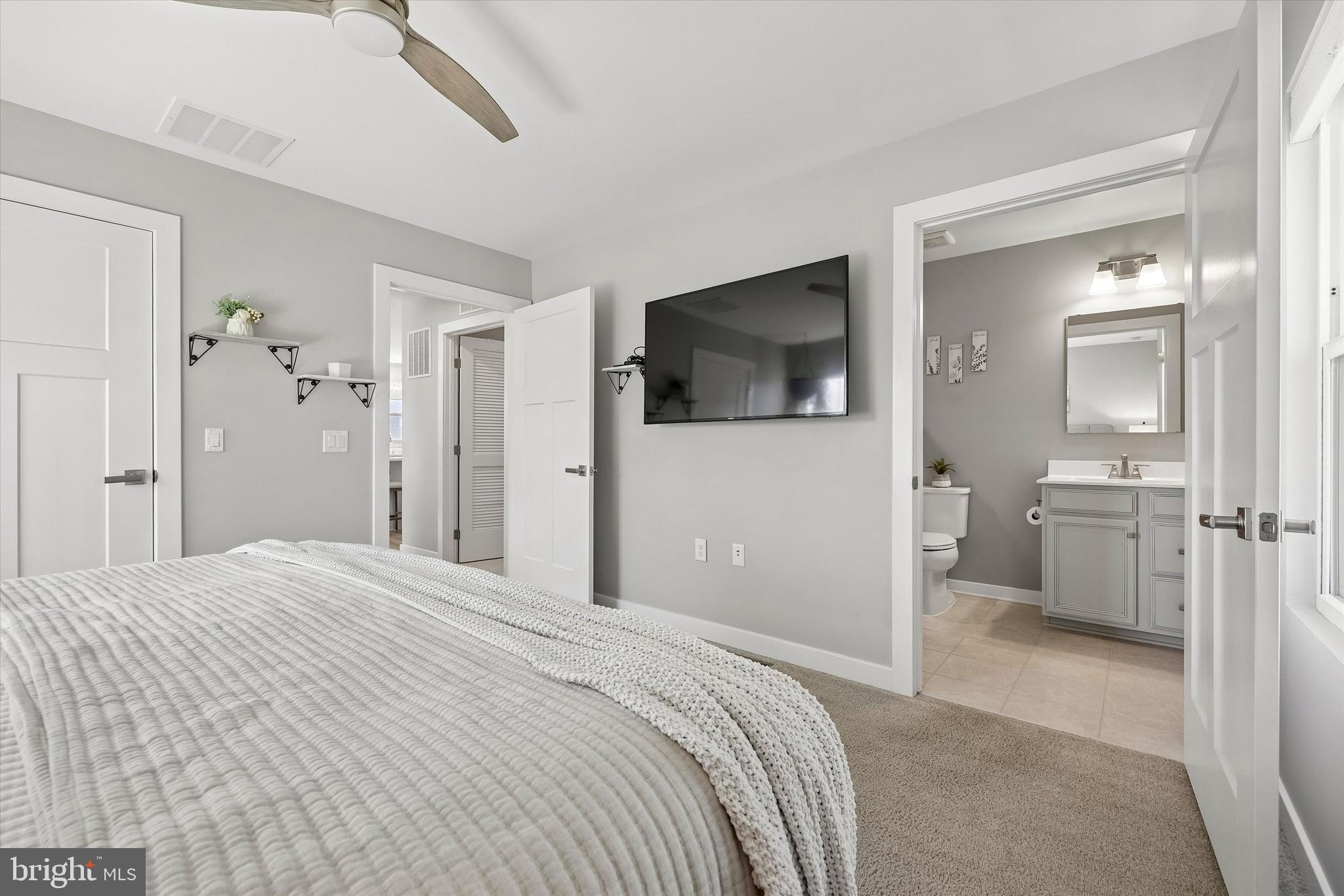 48 Senators Way Berlin, NJ 08009 - Photo 26 of 35 a bedroom with a bed and a flat screen tv