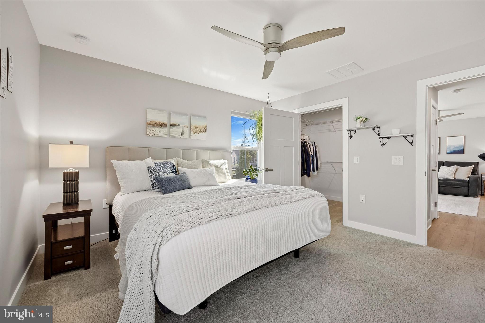 48 Senators Way Berlin, NJ 08009 - Photo 28 of 35 a spacious bedroom with a bed and a walk in closet
