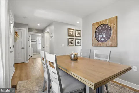 a view of a dining area with furniture and wooden floor