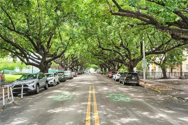 a view of street with parked cars