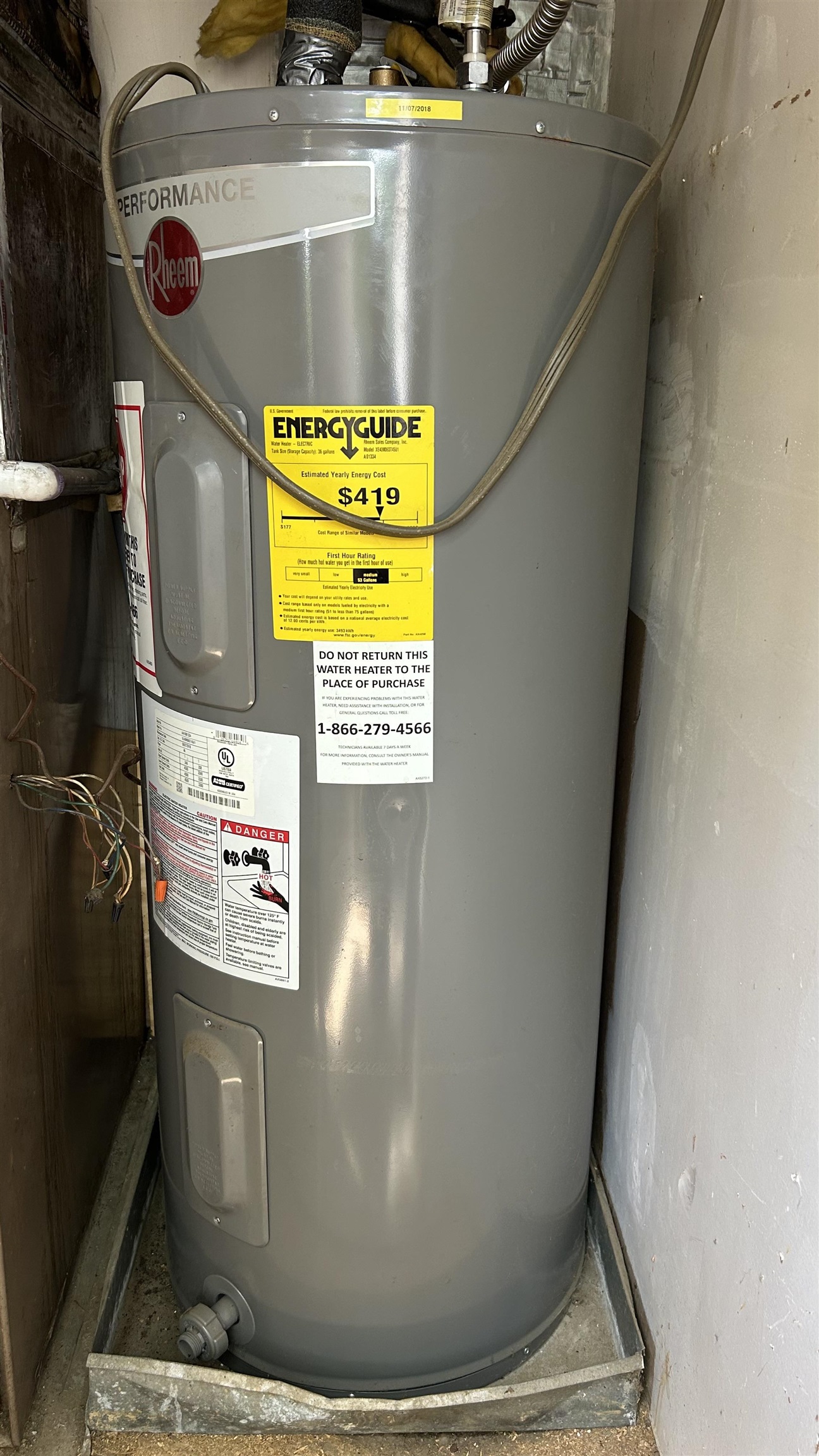 2800 Clarke Road, Unit 2 Memphis, TN 38115 - Photo 18 of 18 Rheem Performance water heater with an Energy Guide label, set within a metal pan