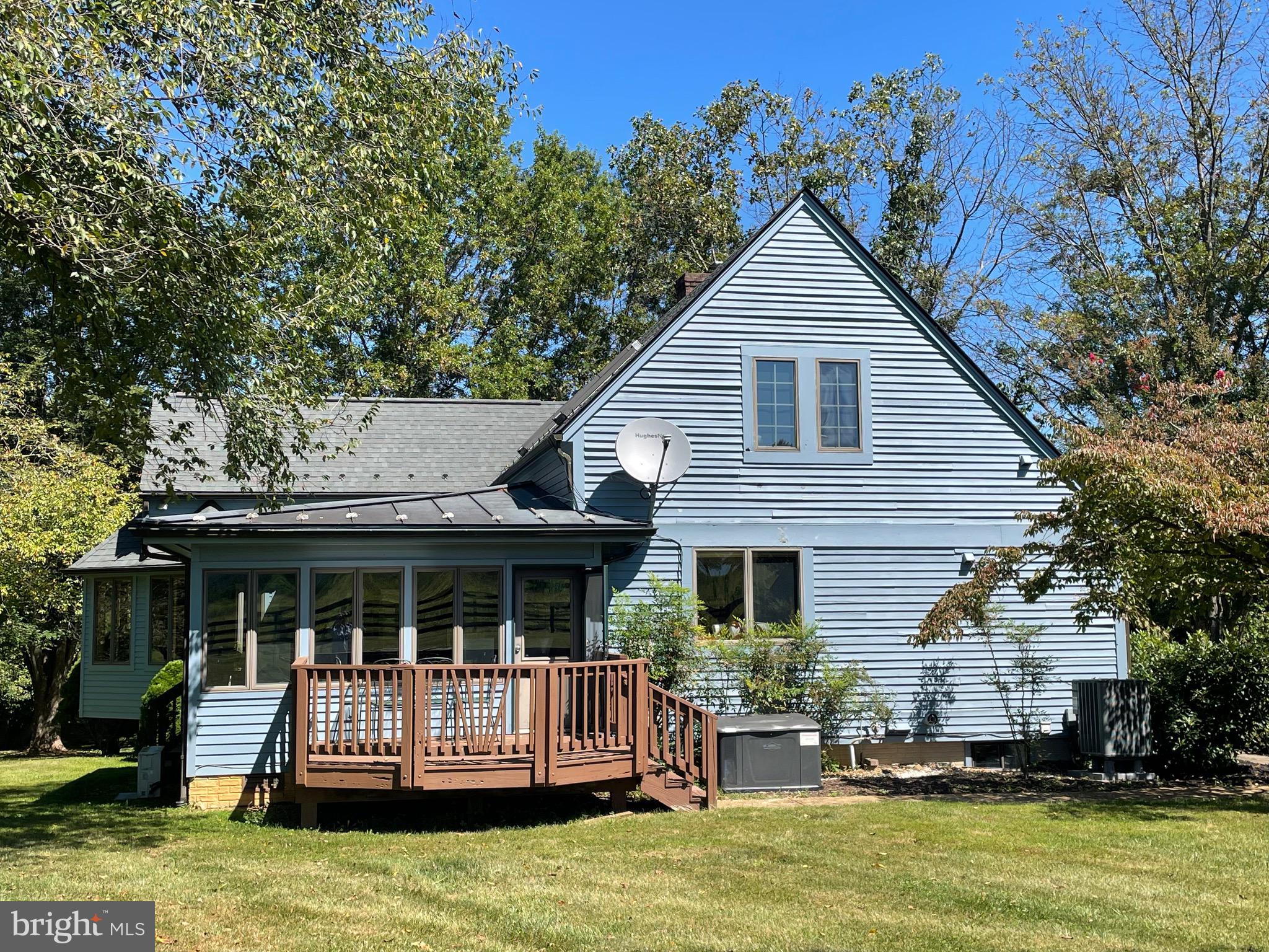 521 Dearing Road Huntly, VA 22640 - Photo 12 of 42 a front view of a house with a garden and porch