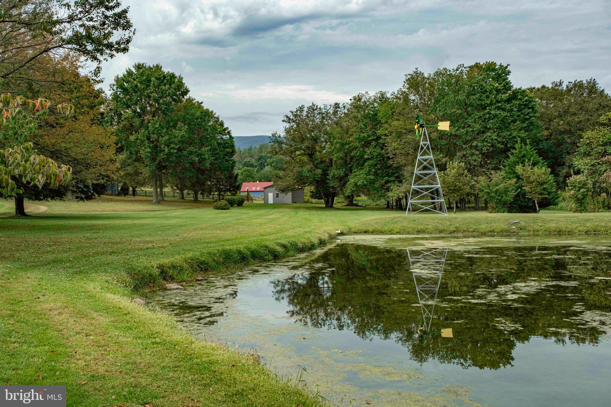 521 Dearing Road Huntly, VA 22640 - Photo 8 of 42 a view of a golf course with a lake