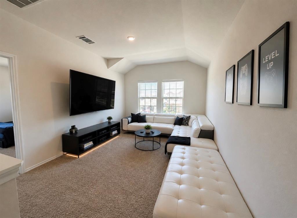 816 Country Road Royse City, TX 75189 - Photo 8 of 24 Spacious game room featuring vaulted ceilings, recessed lighting, and soft carpet flooring