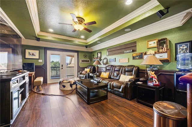 a living room with fireplace furniture and a flat screen tv