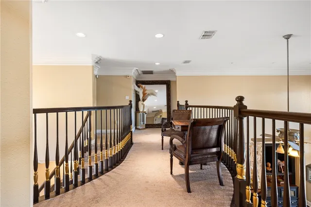 a view of a hallway with chairs
