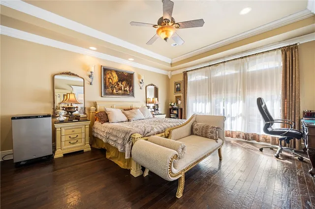 a bed room with furniture and wooden floor