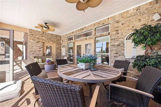 a outdoor dining space with furniture and outdoor view