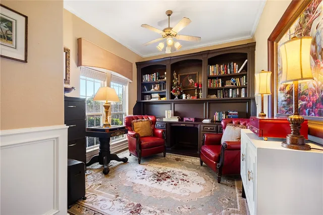 a reading room with furniture toys and a window