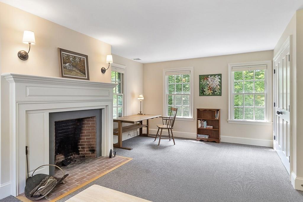 148 Monument Street Concord, MA 01742 - Photo 13 of 25 a living room with furniture and a fireplace