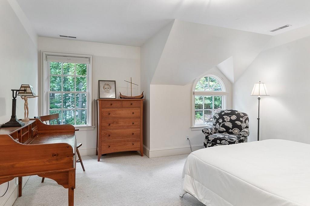 148 Monument Street Concord, MA 01742 - Photo 14 of 25 a bedroom with a bed and wooden floor