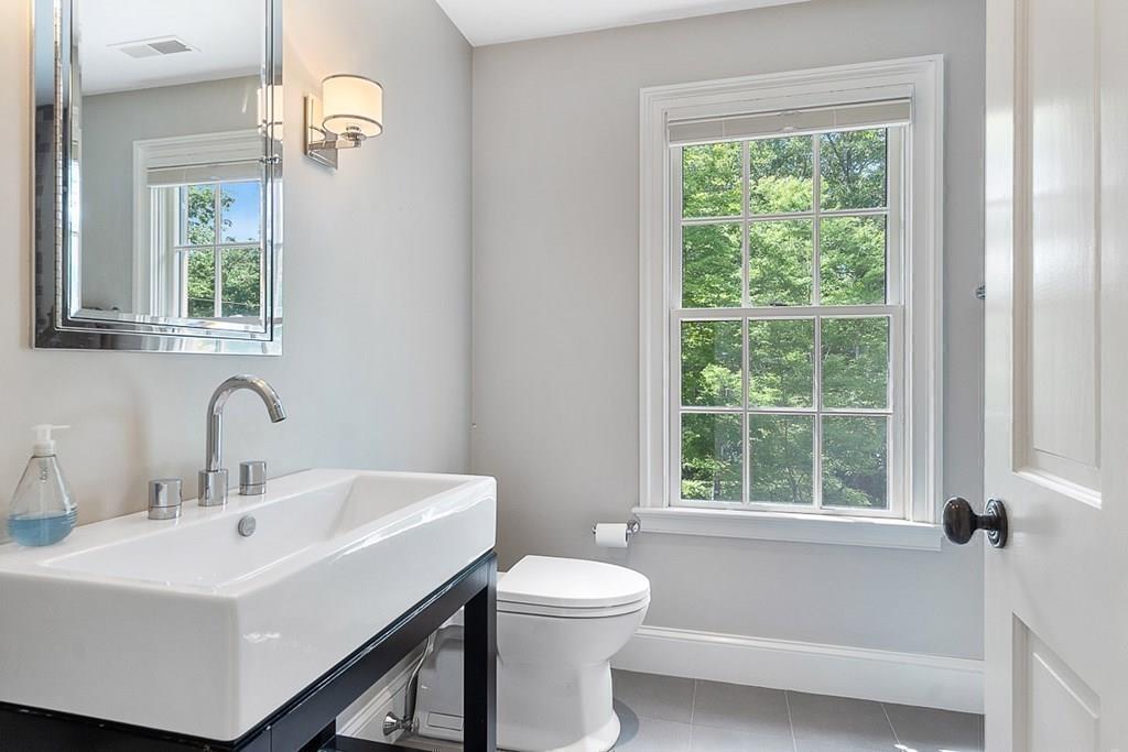 148 Monument Street Concord, MA 01742 - Photo 16 of 25 a bathroom with a sink a toilet and a window
