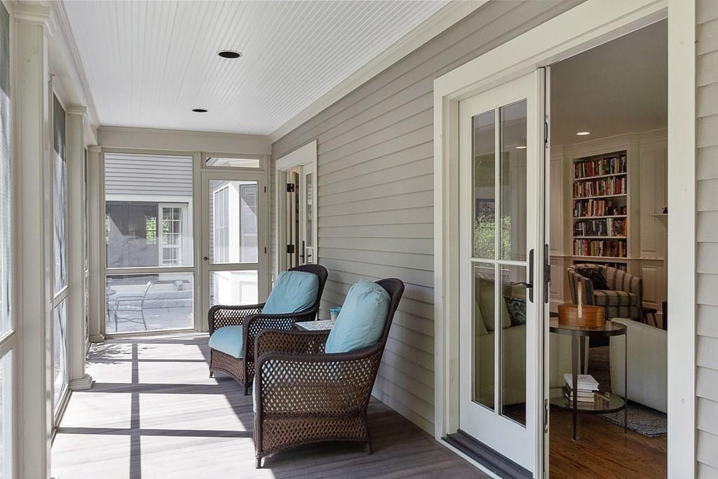 148 Monument Street Concord, MA 01742 - Photo 20 of 25 a balcony with furniture and wooden floor