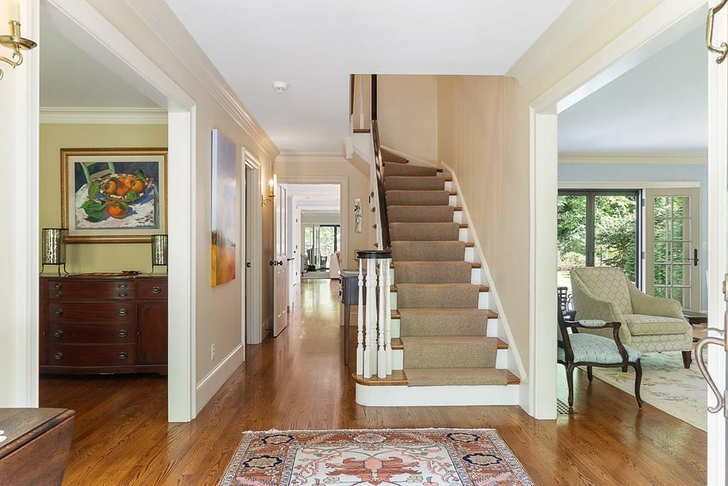 148 Monument Street Concord, MA 01742 - Photo 2 of 25 a view of entryway with wooden floor and glass door