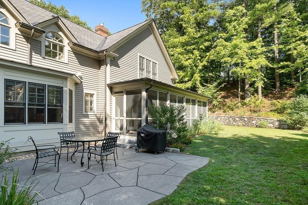 148 Monument Street Concord, MA 01742 - Photo 22 of 25 a view of a house with backyard and sitting area