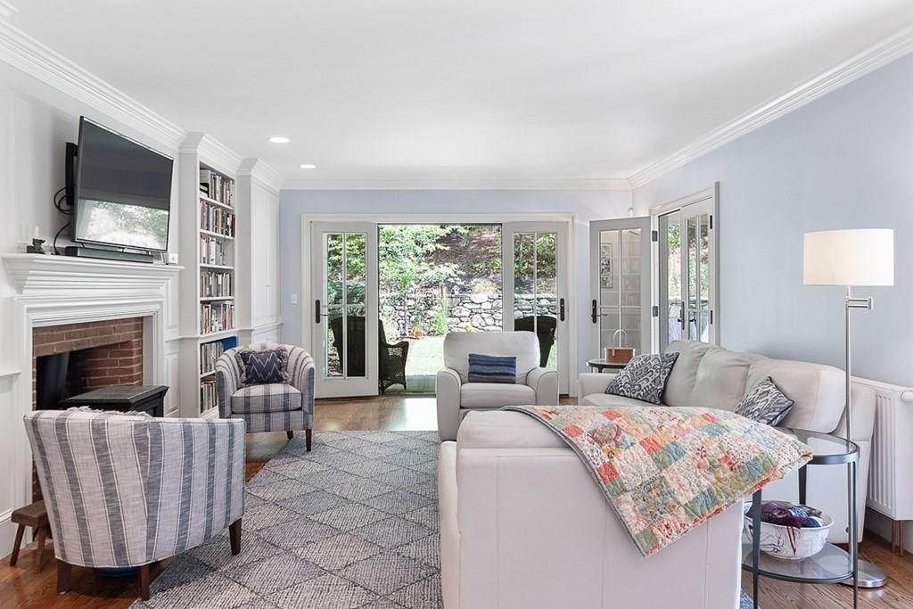 148 Monument Street Concord, MA 01742 - Photo 9 of 25 a living room with furniture fireplace and flat screen tv